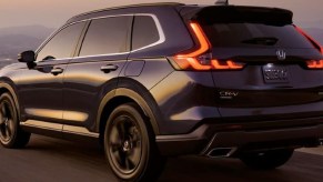 2024 Honda CR-V compact SUV driving on a road.