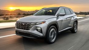 2024 Hyundai Tucson PHEV driving on a road.