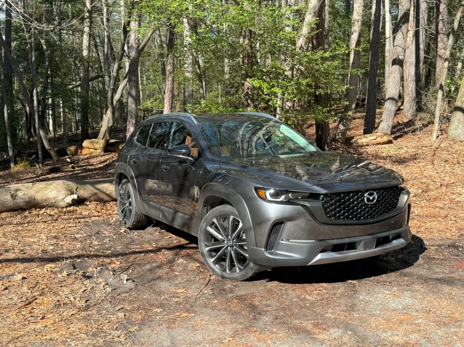 The 2024 Mazda CX-50 off-roading in the woods