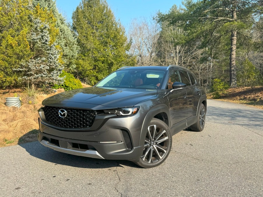 The 2024 Mazda CX-50 parked near trees