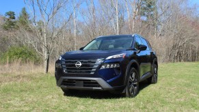 The 2024 Nissan Rogue off-roading in a field