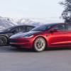 A pair of 2024 Tesla Model 3 EVs cruise on an open road.