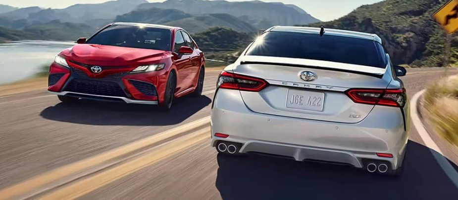 Two 2024 Toyota Camry models on the road