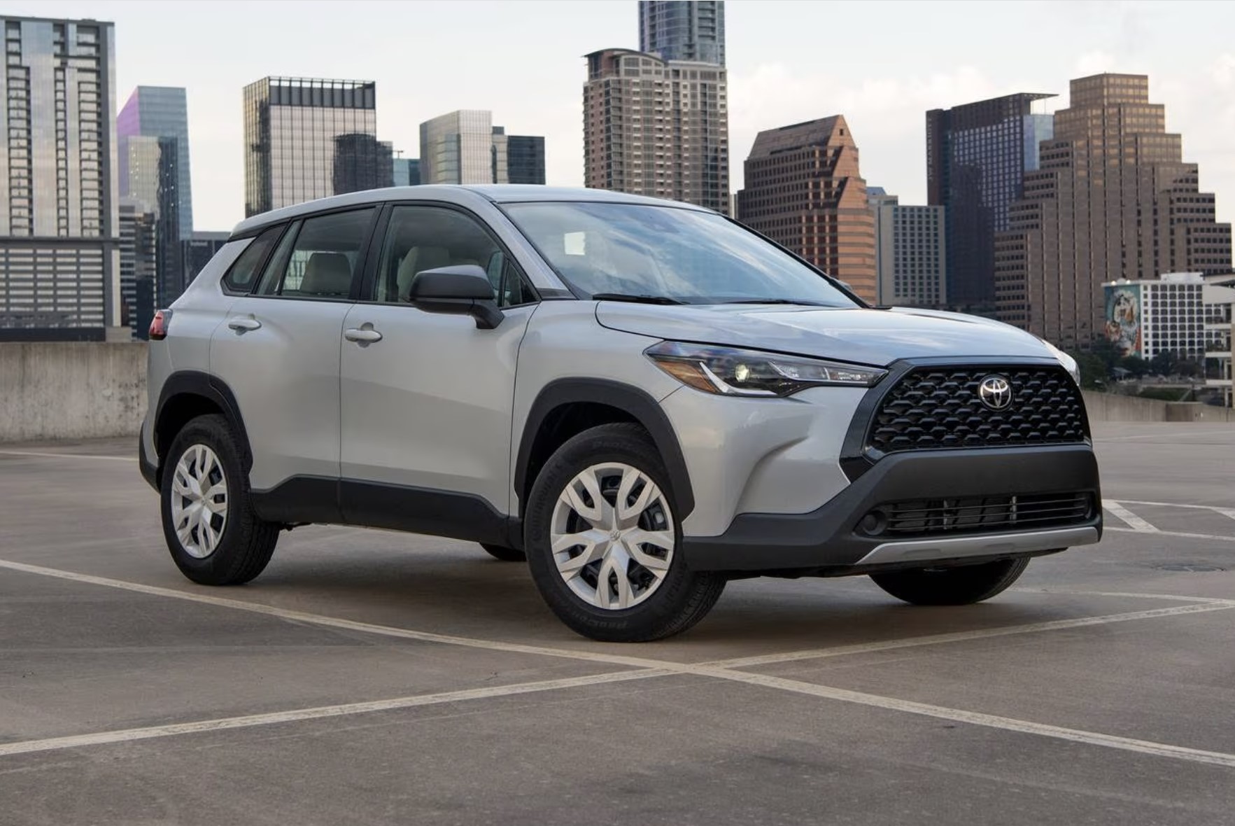 The 2024 Toyota Corolla Cross Hybrid parked near the city 