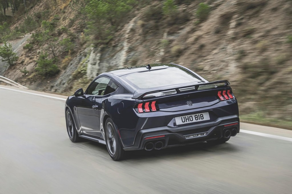 A UK-spec 2024 Ford Mustang Dark Horse goes around a corner. 