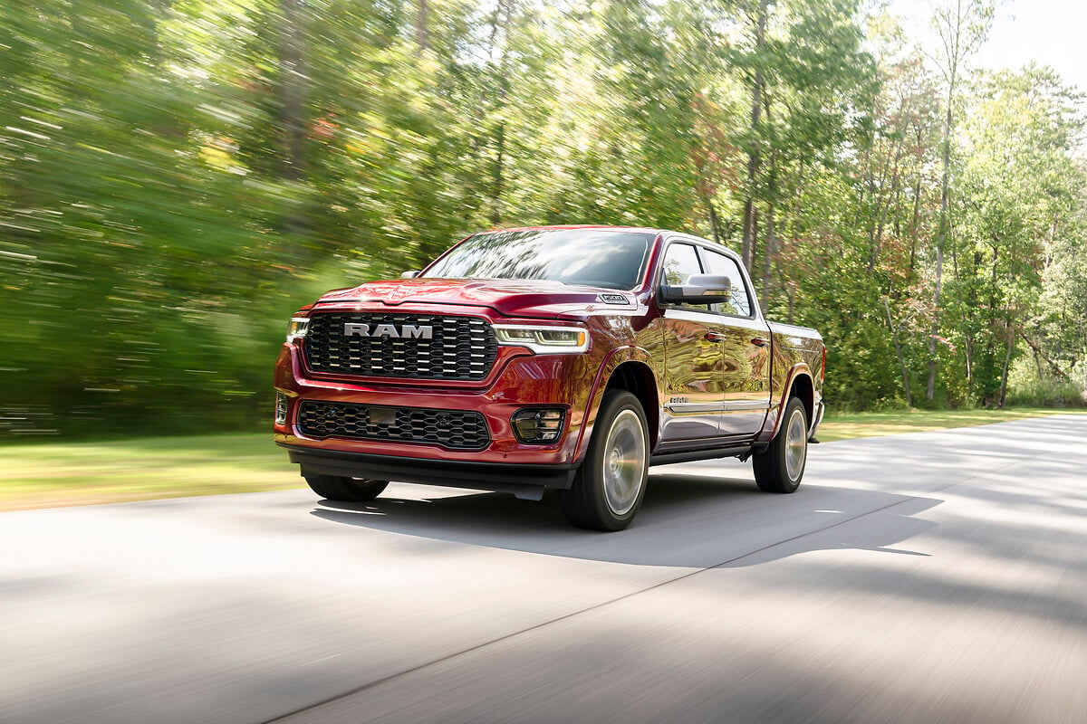 The 2025 Ram 1500 driving down the road