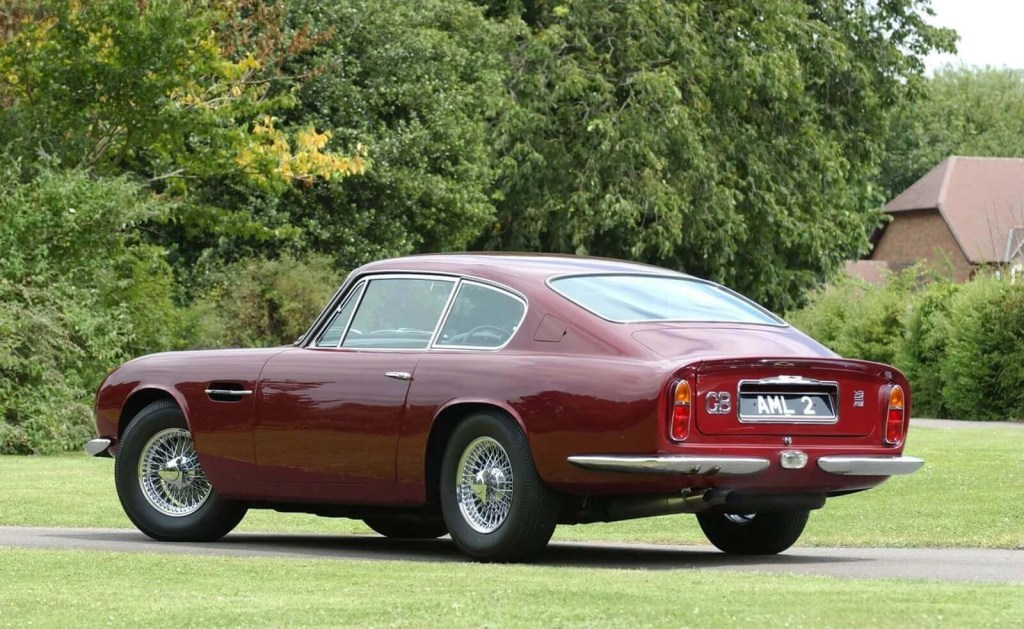 A red Aston Martin DB6 shows off its rear-end styling. 