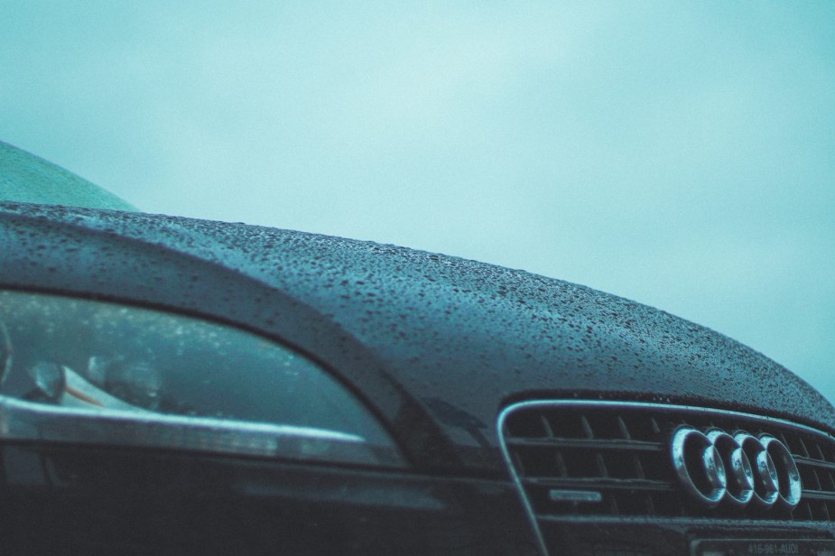 Grille of a black Audi S8 sedan in the rain