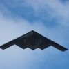 A B-2 Stealth Bomber, like the one captured on Google Earth, cruises overhead.