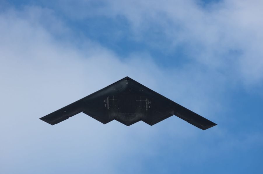 A B-2 Stealth Bomber, like the one captured on Google Earth, cruises overhead.