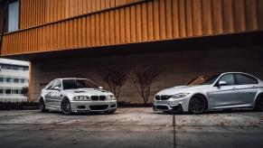 E46 generation BMW M3 parked next to a new 3 Series in front of a brick and metal building