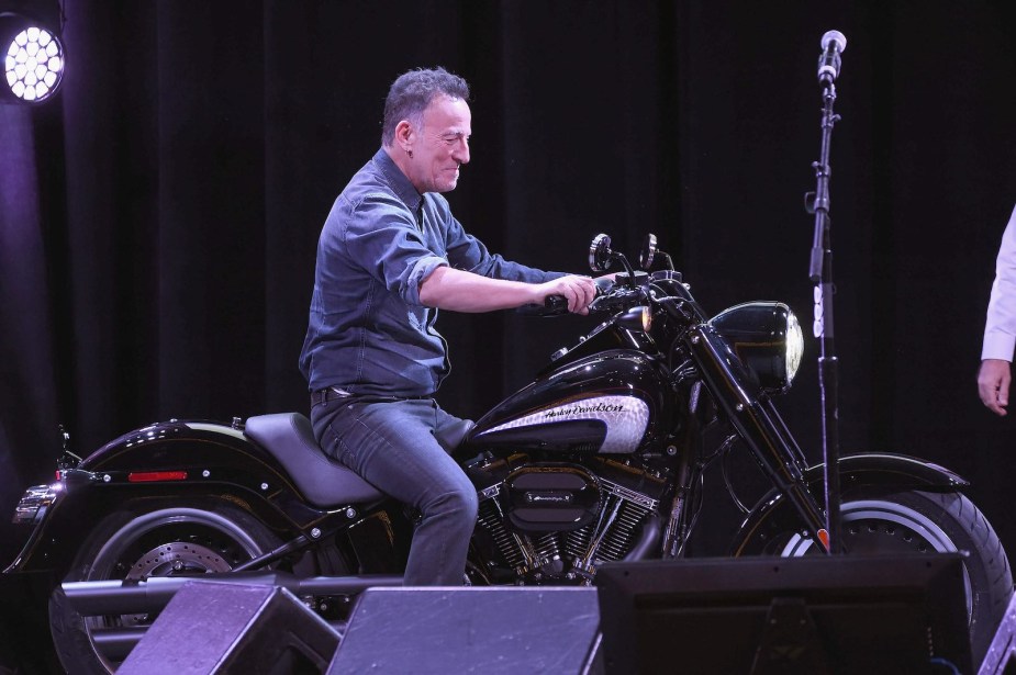 Singer Bruce Springsteen sits on a Harley in Madison Square Garden