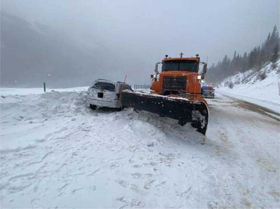 A police chase ends with a snowplow driving into a Jeep Grand Cherokee.