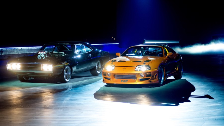 Dodge Charger and Toyota Supra staging a Fast and Furious drag race