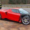 A crashed, red Ferrari Enzo