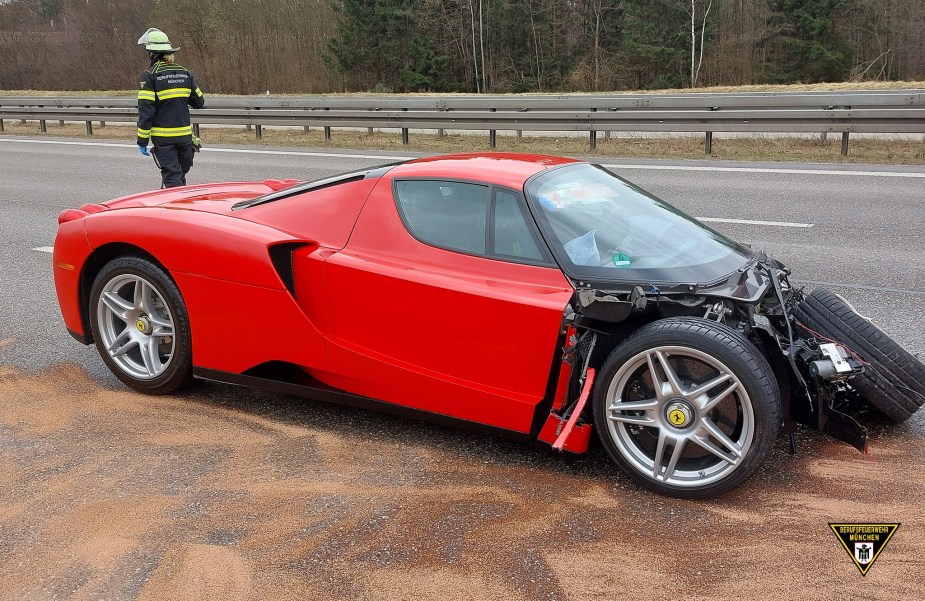 A crashed, red Ferrari Enzo