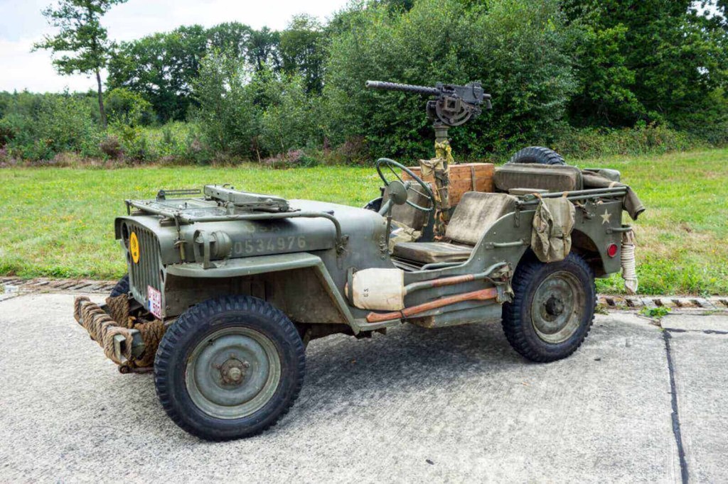 A Willys MB, part of Jeep history, shows off its dropped windshield and .30 caliber machine gun.
