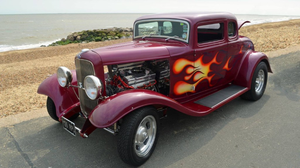 Hot Rod driving on a beach road.