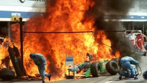Giant fuel fire in Formula 1 pit lane.