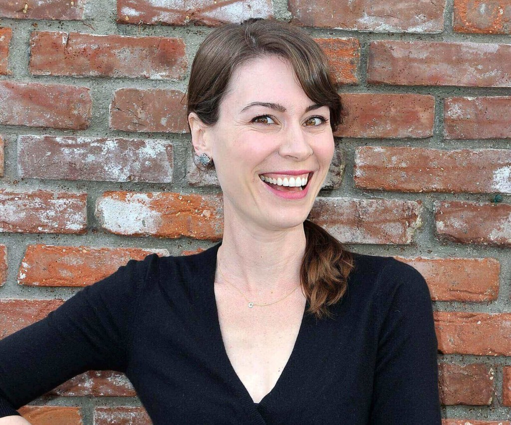 Laurel Coppock, the actor behind 'Toyota Jan' smiles at an event.