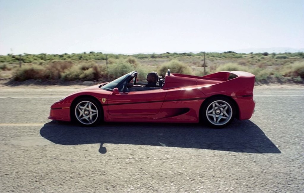 Mike Tyson drives in his now-sold Ferrari F50.