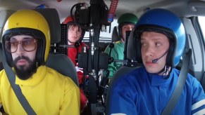 The members of OK Go in their Chevrolet Sonic filming the Needing/Getting music video.