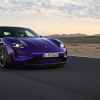 A purple Porsche Taycan Turbo GT with Wiessach package in right front angle view driving on a desert track