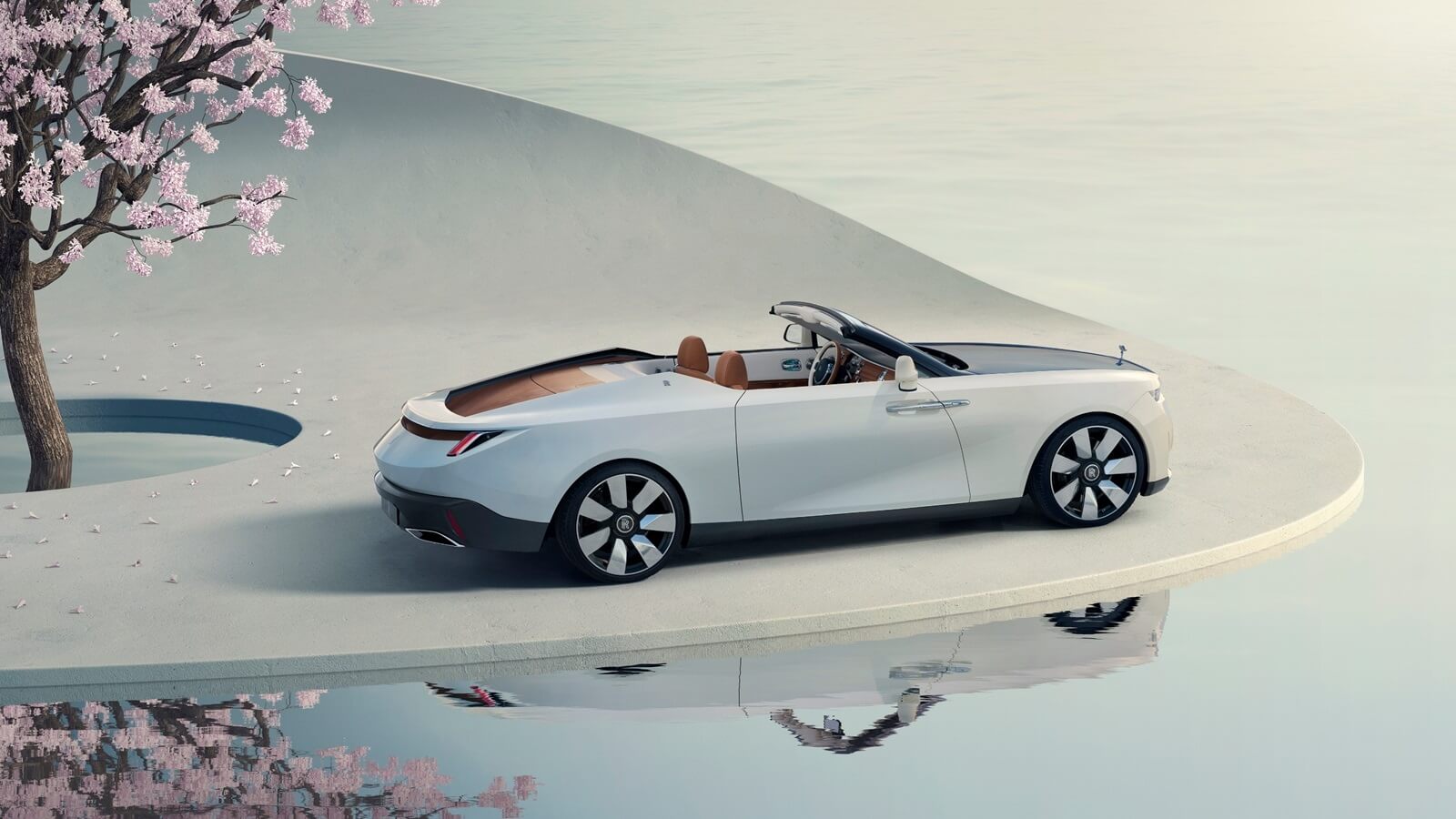 The Rolls-Royce Arcadia Droptail, the world's most expensive new car, sits under cherry blossoms. 