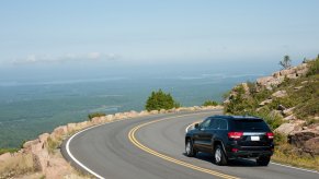 SUV Driving Along a Scenic Highway near Cadillac mountain.