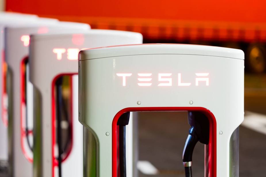 A series of Tesla superchargers in a row.