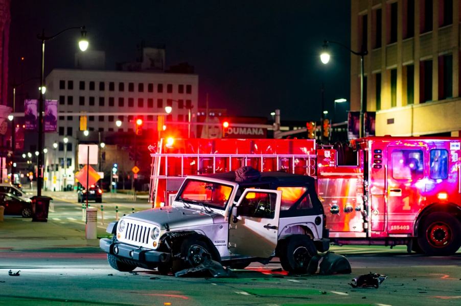 A silver Jeep Wrangler is a totaled car after an accident.