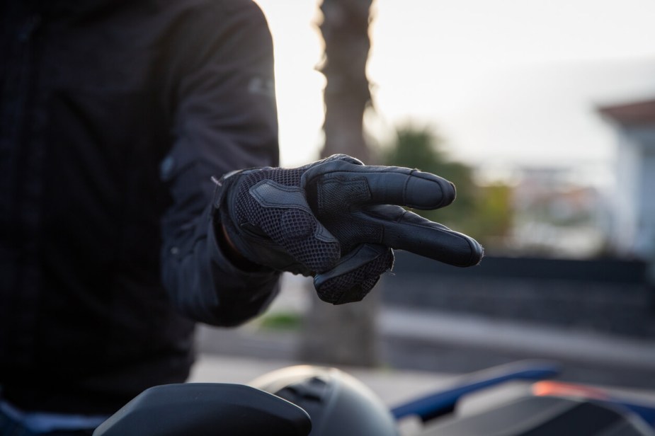 A motorcyclist wave is a hand signal for friendly recognition of another rider.