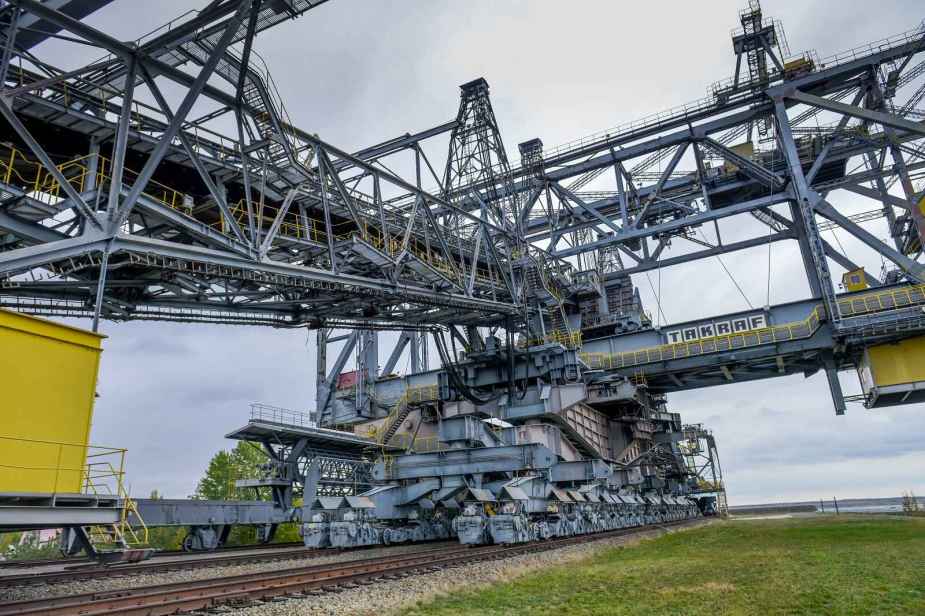 The F60 overburden conveyor bridge world's largest land vehicle is shown on a set of rail tracks in close left front view