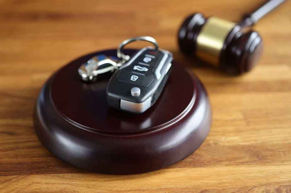 gavel in close view with car key chain
