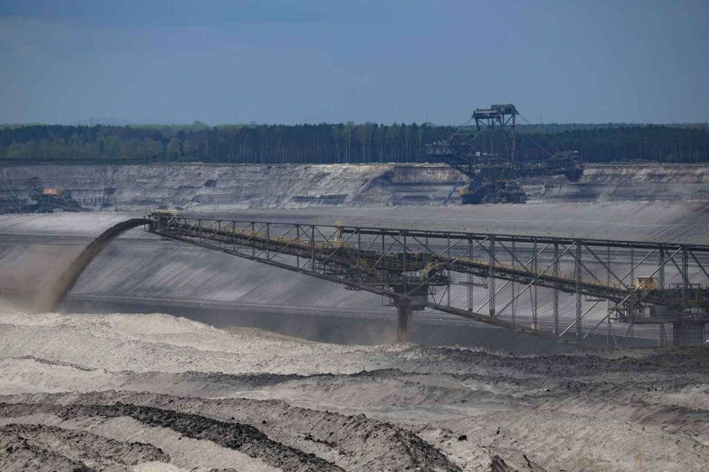 The F60 overburden conveyor bridge the world's largest land vehicle sprays raw earth materials from a mine in Germany