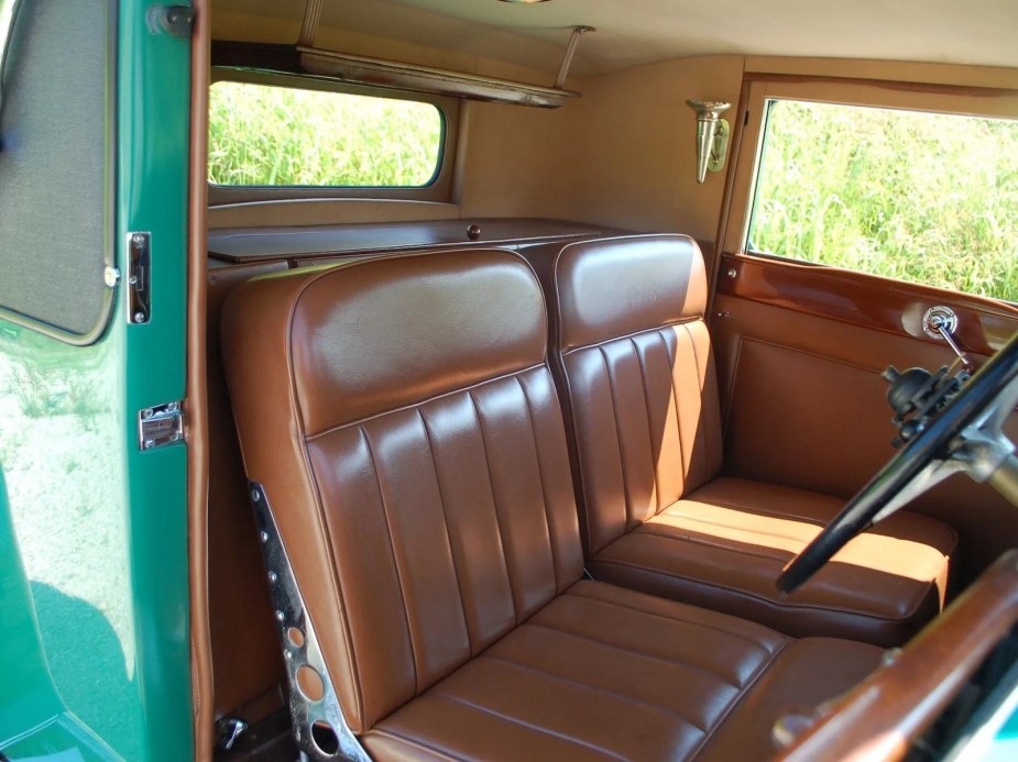 The brown leather interior of an antique Rolls Royce from 1929.