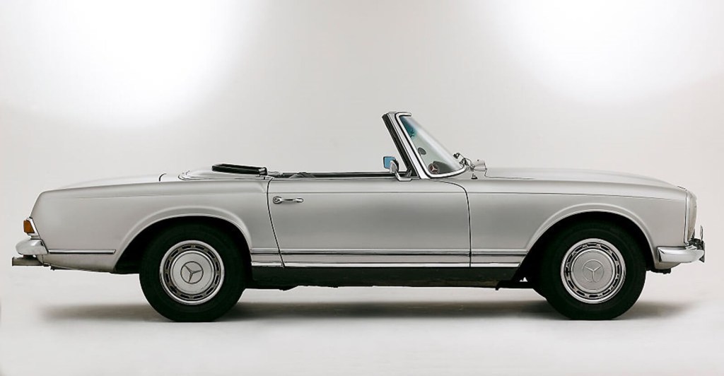 A silver 1969 Mercedes-Benz 280 SL 'Pagoda' shows off its side profile.