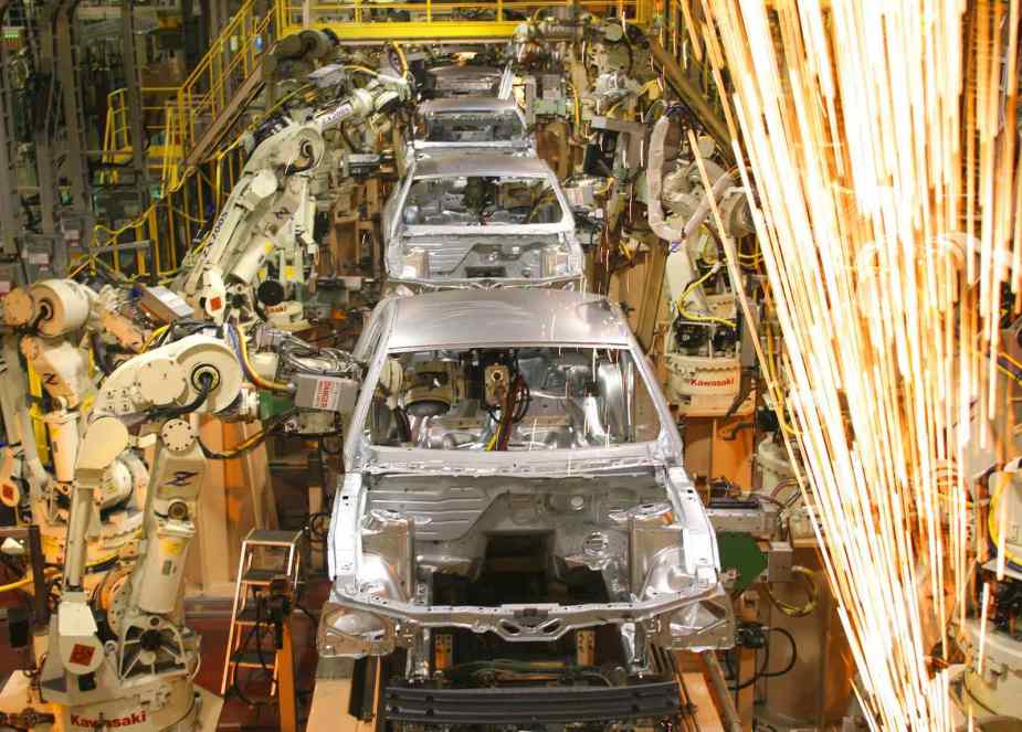 Ford assembling the Mustang muscle cars in a factory.