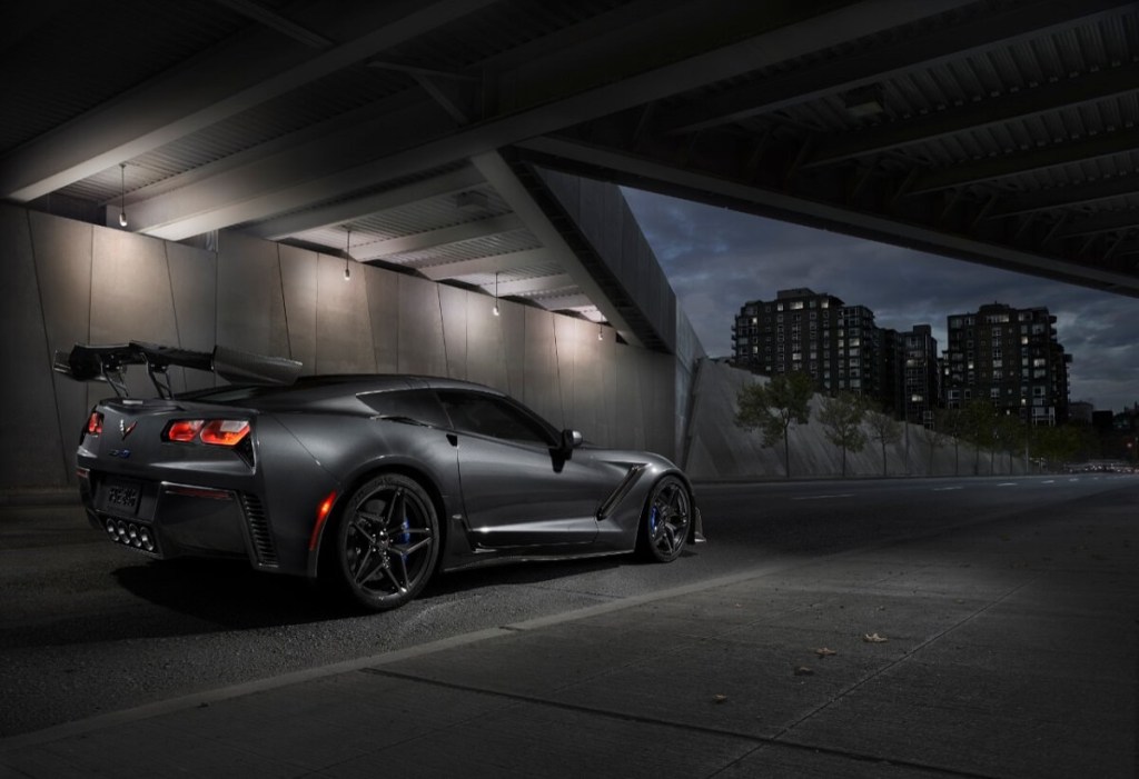 A gray Chevrolet Corvette ZR1 from the C7 generation shows off its wing. 