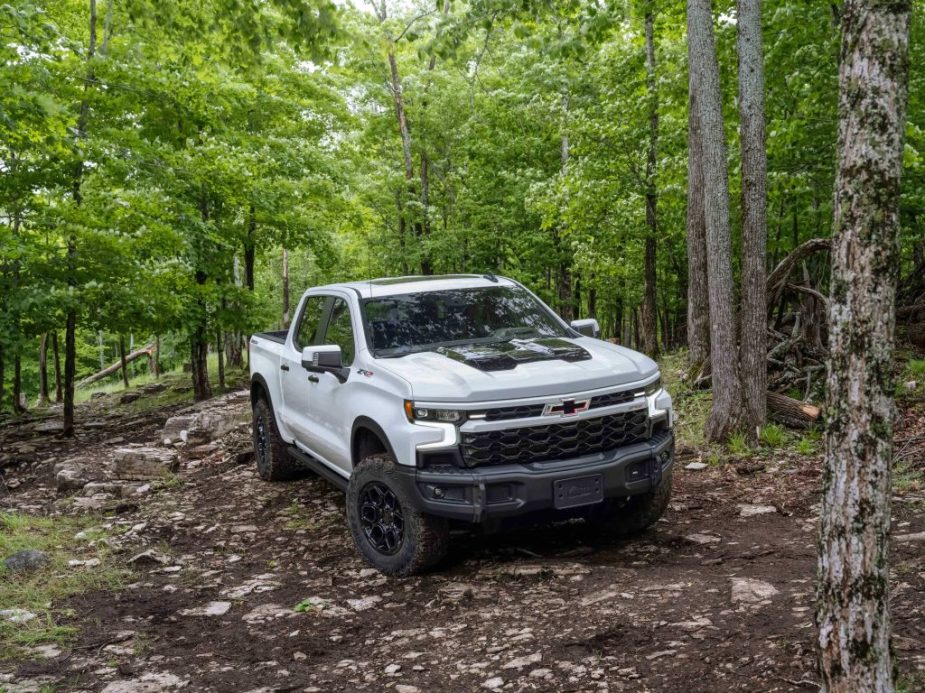 The 2024 Chevy Silverado 1500 off-roading in the woods