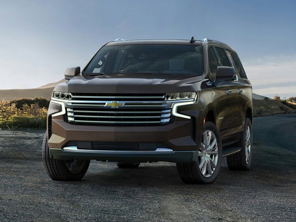 The 2023 Chevy Suburban parked in gravel
