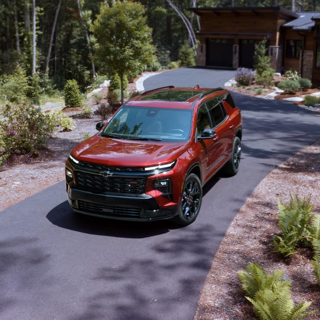 The 2024 Chevy Traverse RS near a home 