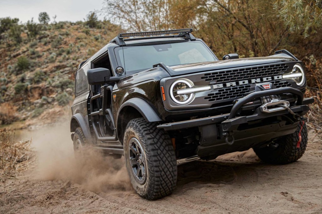 The 2024 Ford Bronco off-roading on a dirt trail