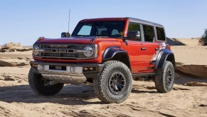 The Ford Bronco Raptor sitting in sand