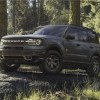 The 2024 Ford Bronco Sport off-roading in the woods