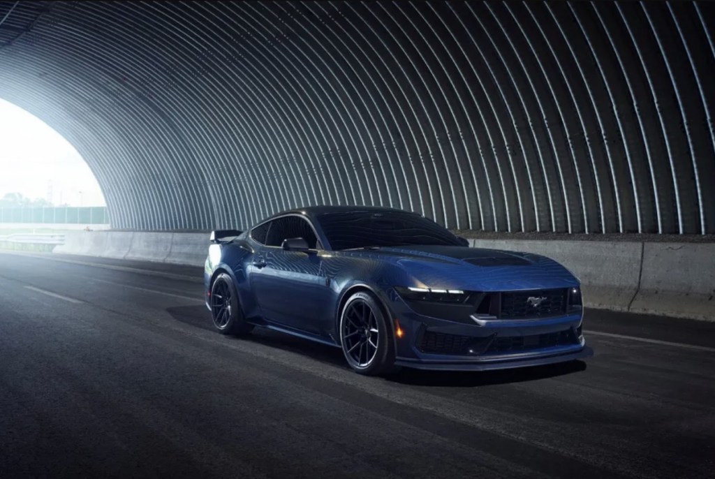 The 2024 Ford Mustang Dark Horse driving on the road