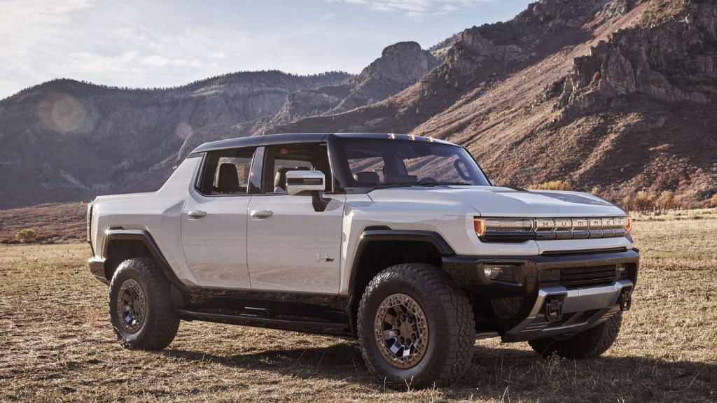 2024 GMC Hummer EV Pickup posed on an off-road trail.
