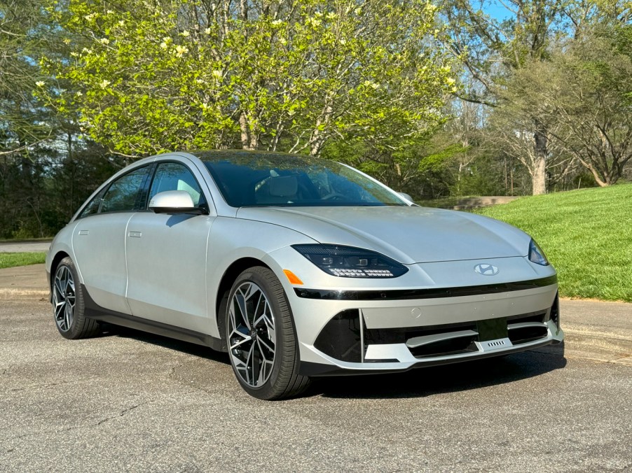 The 2024 Hyundai Ioniq 6 near a flowering tree