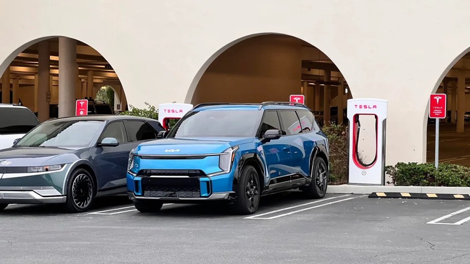 2024 Kia EV9 Plugged into a Tesla Supercharger