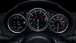 The tachometer and other gauges on a Mazda Miata's dashboard.